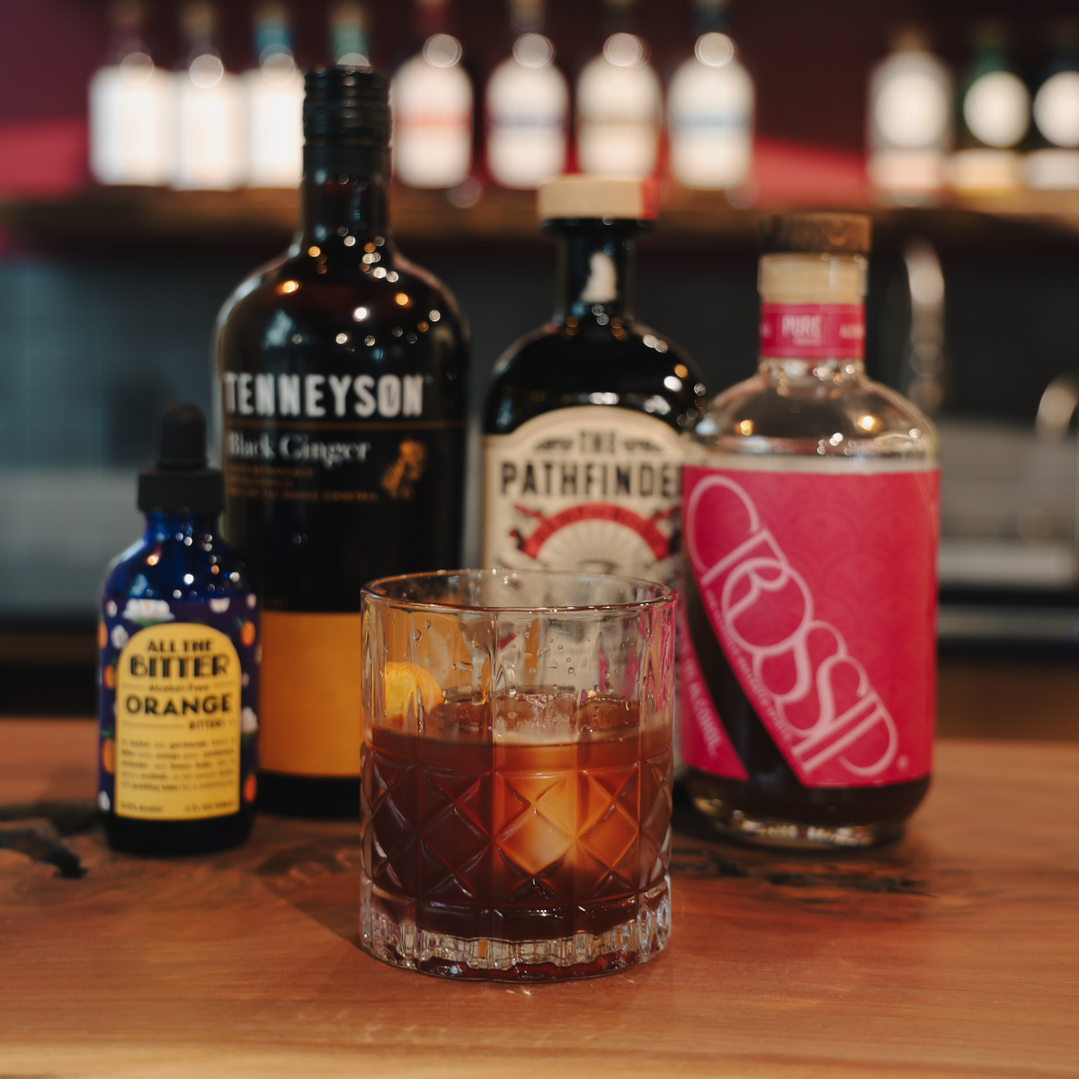 The Atticus botanical zero-proof Negroni riff served over a clear ice block with orange peel
