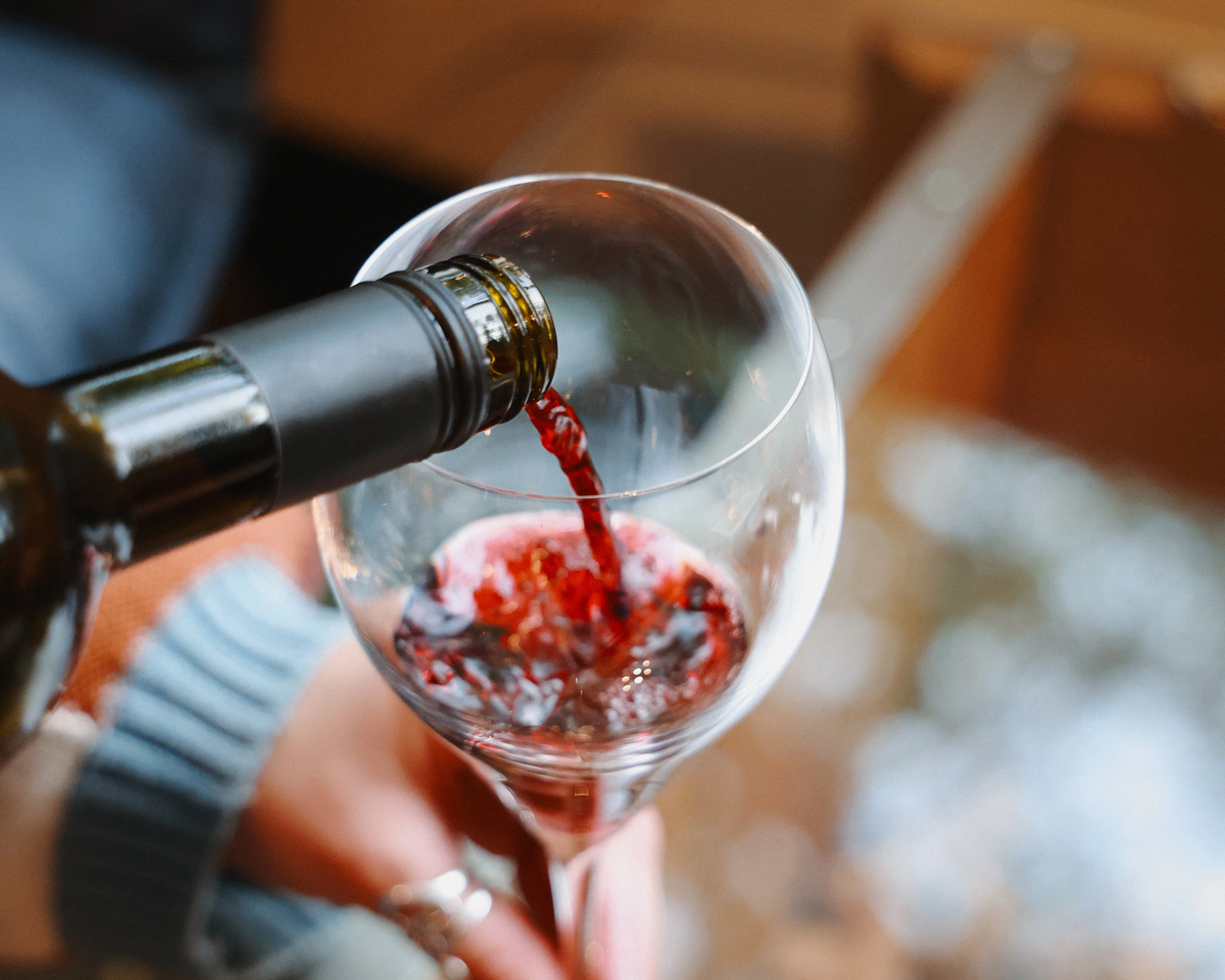 Pouring a glass of premium non-alcoholic dealcoholized red wine at The Søbr Market