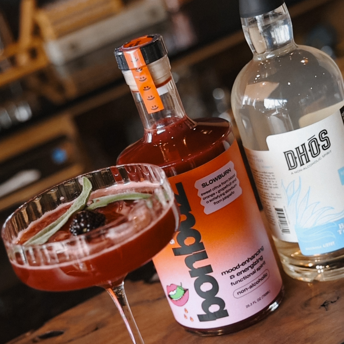 Spicy Sage Awakening non-alcoholic cocktail with fresh sage and chili pepper garnish