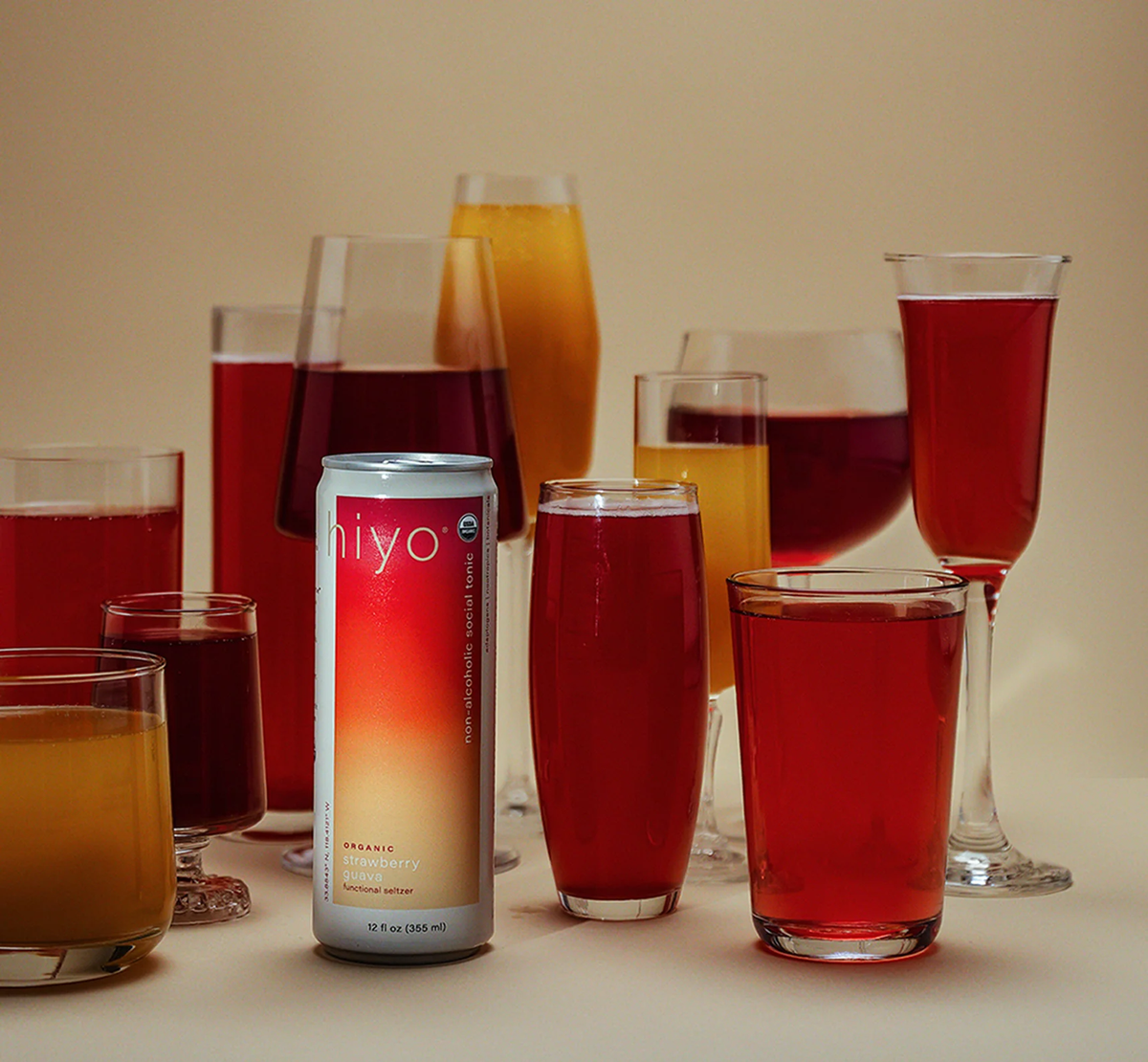 Cans of functional adaptogen tonics and botanical seltzers on a table for evening relaxation and mood support