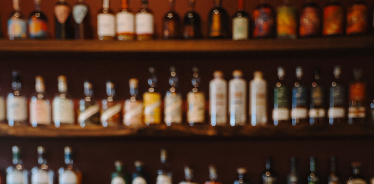 Modern entertaining bar carts styled with zero-proof bottles and glassware