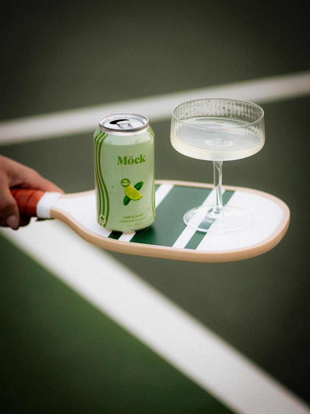 Mōck non-alcoholic craft mojito cans served on ice with fresh mint and lime