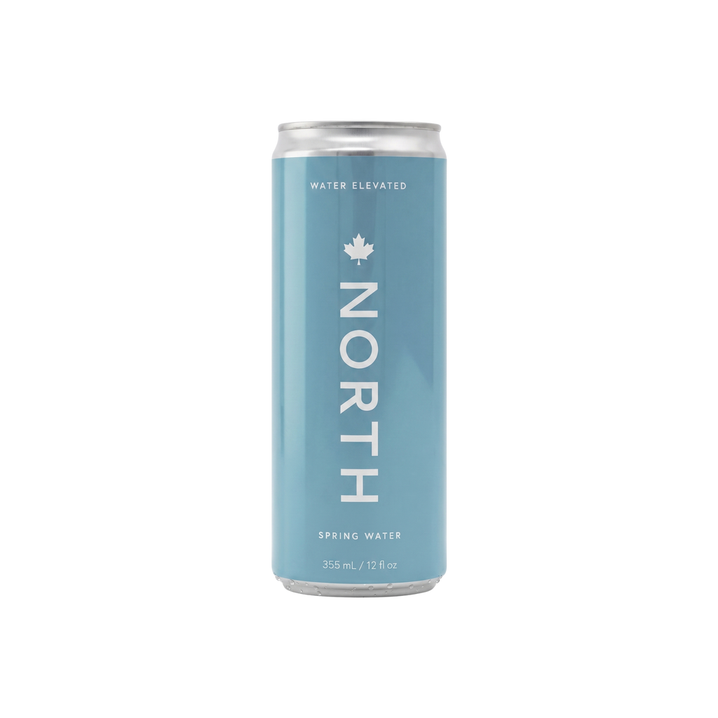 Blue can of North Spring Water on a white background